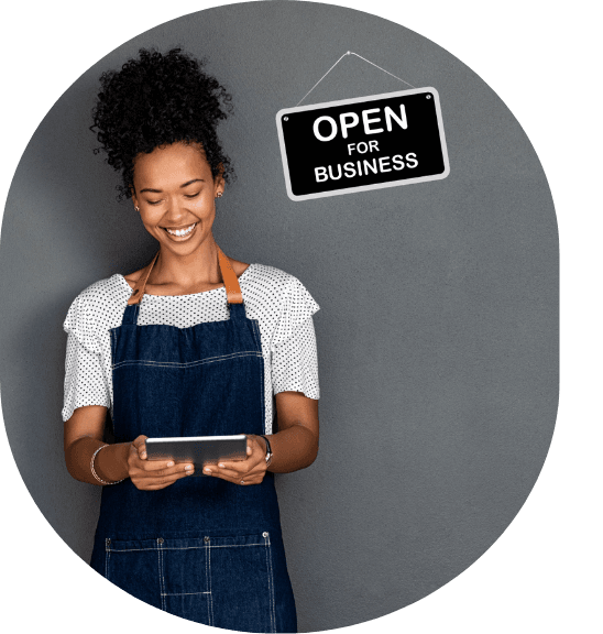 business owner with a tablet smiling profile (548 x 576 px)